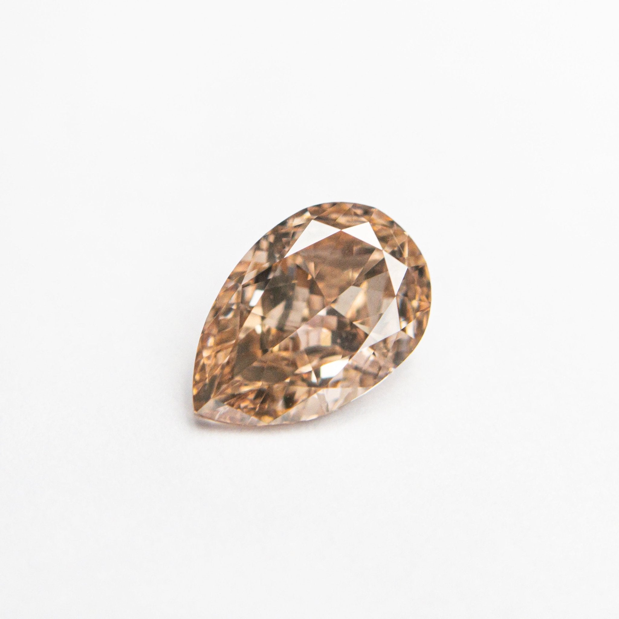 0.68ct 7.06x4.68x2.76mm VS2 Fancy Brownish Pink Pear Brilliant 🇦🇺 24112-01 - MTD