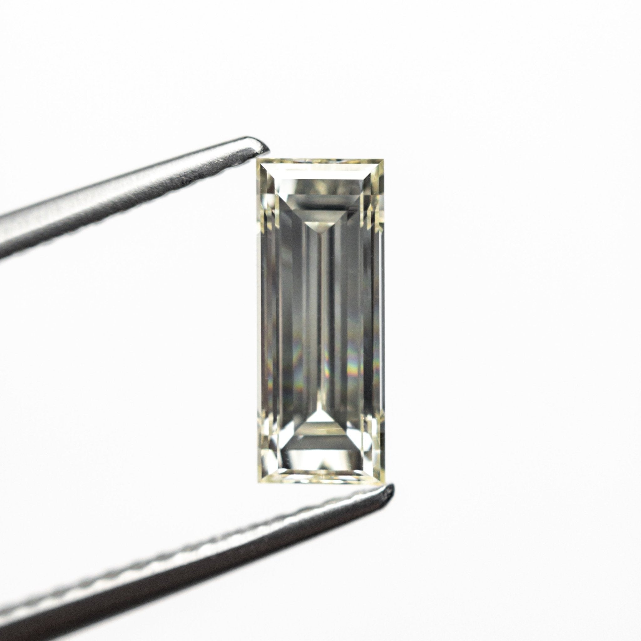 1.11ct 9.55x3.80x2.97mm VS2 O - P Baguette Step Cut 26124 - 02 - MTD