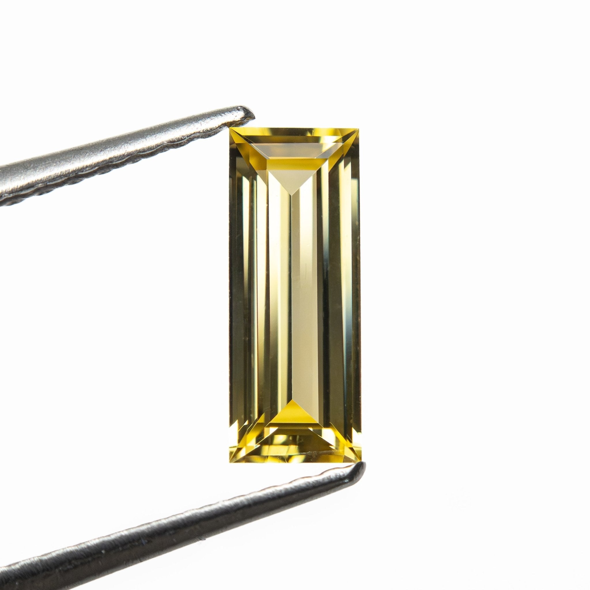 0.79ct 9.06x3.55x2.21mm Baguette Step Cut Sapphire 27719-05 - MTD