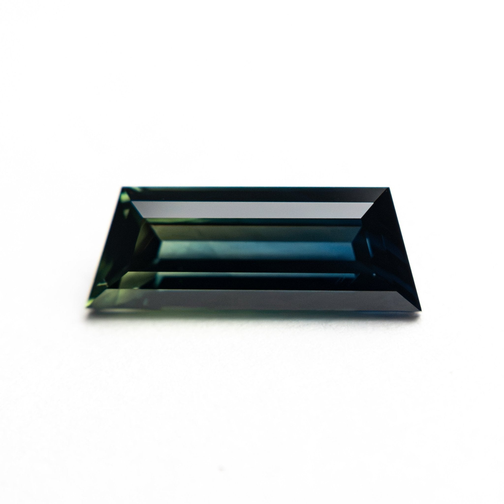 1.31ct 10.46x3.86x2.76mm Trapezoid Step Cut Sapphire 27766-11 - MTD