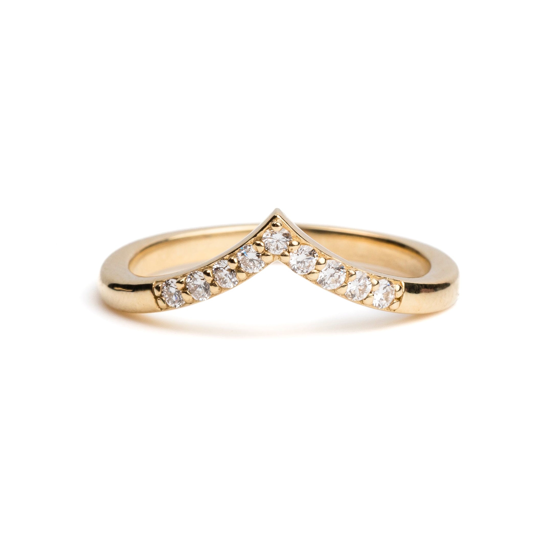 Gold ring with embedded diamonds on a white background