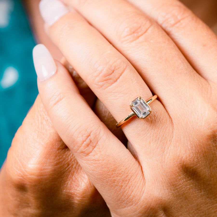 Emerald Cut Diamond In Golden Halo Setting