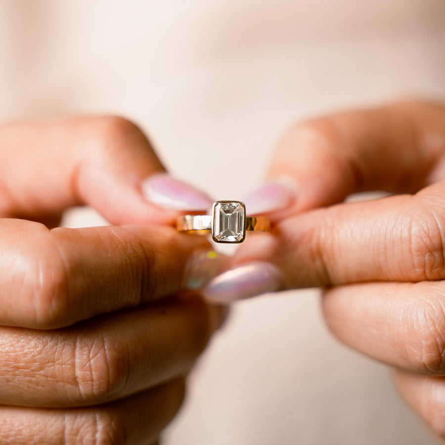 Sheba 2ct Emerald Cut Diamond Engagement Ring Bezel Setting on Wide Hammered Band